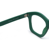 Green eyeglasses on a white background