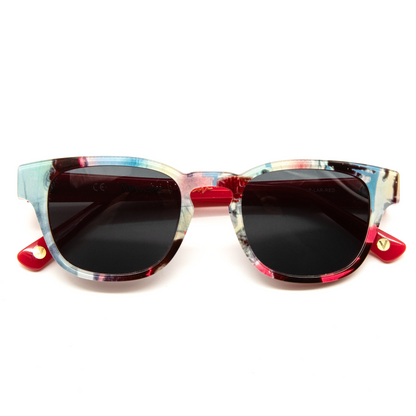 Sunglasses with colorful frame and red accents on a white background